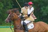 7th Heritage Polo Cup semi-finals: Heloise Lorentzen (1) GB/BRA looking back to receive the ball of the  Amazons of Polo, beside Sarah Wisman Ladies of the British Empire Liberty Freedom..
Hurtwood Park Polo Club,
Ewhurst Green,
Surrey,
United Kingdom,
on 04 August 2012 at 13:28, image #135