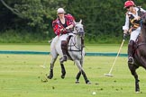 7th Heritage Polo Cup semi-finals: Sarah Wisman of the Ladies of the British Empire gently turning the ball, followed by Erin Jones from South Africa..
Hurtwood Park Polo Club,
Ewhurst Green,
Surrey,
United Kingdom,
on 04 August 2012 at 14:23, image #216