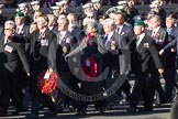 Remembrance Sunday 2012 Cenotaph March Past: Group D1 - South Atlantic Medal Association (www.sama82.org.uk), veterans of the Falklands war in 1982 and islanders from that time. The lady with the wreath and the grey hat is Sukey Cameron, the United Kingdom - Falkland Islands Government Representative..
Whitehall, Cenotaph,
London SW1,

United Kingdom,
on 11 November 2012 at 12:04, image #1206