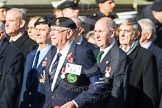 Remembrance Sunday at the Cenotaph in London 2014: Group E4 - Fleet Air Arm Armourers Association.
Press stand opposite the Foreign Office building, Whitehall, London SW1,
London,
Greater London,
United Kingdom,
on 09 November 2014 at 11:50, image #618