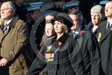 Remembrance Sunday at the Cenotaph in London 2014: Group M23 - Civilians Representing Families.
Press stand opposite the Foreign Office building, Whitehall, London SW1,
London,
Greater London,
United Kingdom,
on 09 November 2014 at 12:18, image #2156