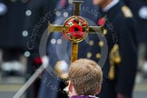 Remembrance Sunday at the Cenotaph in London 2014: The golden cross with the red poppies, carried by the Cross Bearer, in fron of members of the Royal Family.
Press stand opposite the Foreign Office building, Whitehall, London SW1,
London,
Greater London,
United Kingdom,
on 09 November 2014 at 11:03, image #183