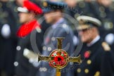 Remembrance Sunday at the Cenotaph in London 2014: The golden cross with the poppies, behind, and out of focus, the Duke of Edinburgh, the Duke of Cambridge, and the Duke of York.
Press stand opposite the Foreign Office building, Whitehall, London SW1,
London,
Greater London,
United Kingdom,
on 09 November 2014 at 11:16, image #266