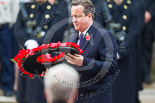 Remembrance Sunday at the Cenotaph 2015: The Prime Minister, David Cameron, about to lay his wreath at the Cenotaph. Image #204, 08 November 2015 11:06 Whitehall, London, UK