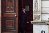 The doors of the Foreign and Commonwealth Office are opened on a wet morning before the Remembrance Sunday Cenotaph Ceremony 2018 at Horse Guards Parade, Westminster, London, 11 November 2018, 08:04.