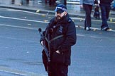 Armed police on Whitehall before the Remembrance Sunday Cenotaph Ceremony 2018 at Horse Guards Parade, Westminster, London, 11 November 2018, 08:31.