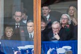 Guests watching from one of the windows next to the Foreign and Commonwealth Office entrance before the Remembrance Sunday Cenotaph Ceremony 2018 at Horse Guards Parade, Westminster, London, 11 November 2018, 10:46.