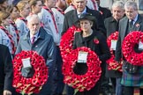 The Rt Hon Jeremy Corbyn MP, (Leader of the Labour Party and Leader of the Opposition)   and the Rt Hon Theresa May MP, Prime Minister, on behalf of the Government, leaving the Foreign and Commonwealth Office with their wreath during Remembrance Sunday Cenotaph Ceremony 2018 at Horse Guards Parade, Westminster, London, 11 November 2018, 10:55.