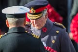 Commander Iain Kearsley, Royal Navy, Equerry to HRH The Prince of Wales  , handing of the wreath to HRH The Prince of Wales (Prince Charles) during the Remembrance Sunday Cenotaph Ceremony 2018 at Horse Guards Parade, Westminster, London, 11 November 2018, 11:05.