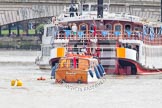 The Boat Race 2012: One of the boats taking part in the flotilla following the Boat Race behind a passenger boat with spectators, in front of Putney Bridge..




on 07 April 2012 at 13:37, image #152