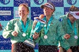 The Boat Race season 2017 -  The Cancer Research Women's Boat Race: CUWBC and lots of Champagne, here, with the Women's Boat Race trophy, bow Ashton Brown, 2 Imogen Grant, and 3 Claire Lambe.
River Thames between Putney Bridge and Mortlake,
London SW15,

United Kingdom,
on 02 April 2017 at 17:13, image #274