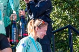 The Boat Race season 2017 -  The Cancer Research Women's Boat Race: CUWBC's 3 seat Claire Lambe leaving the price giving, with two bottles of Chapel Down Champagne, carried by other crew members.
River Thames between Putney Bridge and Mortlake,
London SW15,

United Kingdom,
on 02 April 2017 at 17:14, image #304