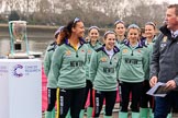 The Cancer Research UK Women's Boat Race 2018: The Cambridge crew with the Women's Boat Race trophy at the toss - president Daphne Martschenko (rowing in the reserve boat), cox Sophie Shapter, 6 Alice White, 7 Myriam Goudet-Boukhatmi, and in the second row 2 seat Imogen Grant, 3 Kelsey Barolak, 4 Thea Zabell, and 5 Paula Wesselmann. On the right race umpire Sir Matthew Pinsent..
River Thames between Putney Bridge and Mortlake,
London SW15,

United Kingdom,
on 24 March 2018 at 14:41, image #47