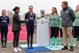 The Cancer Research UK Women's Boat Race 2018: Zahara Alacia, the young lady throwing the coin at the reserve boat toss, with Oxford stroke Anna Murgatroyd on the left, and Cambridge president Daphne Martschenko on the right of the Women's Boat Race trophy.
River Thames between Putney Bridge and Mortlake,
London SW15,

United Kingdom,
on 24 March 2018 at 14:55, image #71