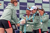 The Cancer Research UK Women's Boat Race 2018: Cambridge 7 seat Myriam Goudet-Boukhatmi ho;ding the Women's Boat Race trophy, and cox Sophie Shapter filling it with champagne.
River Thames between Putney Bridge and Mortlake,
London SW15,

United Kingdom,
on 24 March 2018 at 17:09, image #288