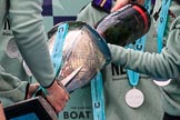 The Cancer Research UK Women's Boat Race 2018: Cambridge 7 seat Myriam Goudet-Boukhatmi ho;ding the Women's Boat Race trophy, and cox Sophie Shapter filling it with champagne.
River Thames between Putney Bridge and Mortlake,
London SW15,

United Kingdom,
on 24 March 2018 at 17:09, image #289