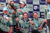 The Cancer Research UK Women's Boat Race 2018: The Cambridge women celebrating with their Boat Race medals, the Women's Boat Race trophy, and lots of Chapel Down Brut: Thea Zabell, Kelsey Barolak, CUWBC Head Coach Rob Baker, and, on their knees, Sophie Shapter, Imogen Grant, and Tricia Smith.
River Thames between Putney Bridge and Mortlake,
London SW15,

United Kingdom,
on 24 March 2018 at 17:09, image #294