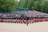 Trooping the Colour 2010: The Band of the Grenadier Guards is marching into their starting position for the parade.

The Colour Sergeant (bottom middle) is observing the proceedings.

The bands of the Irish Guards (blue plumes on the bearskins) and Coldstream Guards (red plumes) have already taken their positions.

The public stands behind the bands are at the rear of the garden of No. 10 Downing Street..
Horse Guards Parade, Westminster,
London SW1,
Greater London,
United Kingdom,
on 12 June 2010 at 10:32, image #17