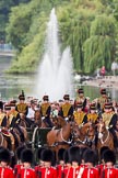 Trooping the Colour 2010: Behind No. 1 Guard,  1st Battalion Grenadier Guards, and in front of spectators watching from St. James's Park, with a lake and fountain in the background, is The King's Troop Royal Horse Artillery, with their horses and 13-pounder state saluting guns..
Horse Guards Parade, Westminster,
London SW1,
Greater London,
United Kingdom,
on 12 June 2010 at 10:44, image #29