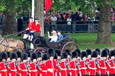 Trooping the Colour 2010: Prince William elser son elder son of Charles, Prince of Wales, and Diana, Princess of Wales, and grandson of Queen Elizabeth II and Prince Philip, Duke of Edinburgh, and The Duchess of Cornwall,Camilla Parker Bowles, the wife of Prince Charles, in their barouche on the way from Buckingham Palace to Horse Guards Building, where they are going to watch the parade from the General Major's office, the room that was once used by the Duke of Wellington as his office.

In the photo, the barouche is coming down Horse Guards Road, passing one of the 53 flags representing the countries of the Commonwealth..
Horse Guards Parade, Westminster,
London SW1,
Greater London,
United Kingdom,
on 12 June 2010 at 10:49, image #33