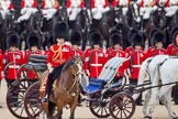 Trooping the Colour 2010: The Ivory Mounted Phaeton with Her Majesty, inspecting the line, is passing behind 'Roly' Walker, the Field Officer in Brigade Waiting, and &quot;boss&quot; of the parade, riding Burniston, a brown mare that is said to know all the commands..
Horse Guards Parade, Westminster,
London SW1,
Greater London,
United Kingdom,
on 12 June 2010 at 11:03, image #79