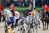 Trooping the Colour 2010: Her Majesty The Queen, sitting in her Ivory Mounted Phaeton,  inspecting the line of soldiers on the parade ground.

Following the carriage the Royal Colonels, Prince Charles (cut off at the very left), the Duke of Kent, and the Princess Royal.

In the background spectators watching from St. James's Park, on the western end of the parade ground, and in the foreground one of the Drum Majors..
Horse Guards Parade, Westminster,
London SW1,
Greater London,
United Kingdom,
on 12 June 2010 at 11:06, image #91