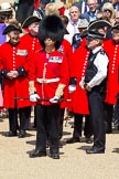 The Colonel's Review 2011: Chelsea Pensioners' (ex-servicemen and -women, in-pensioners living at the Royal Hospital Chelsea), in their scarlet coats and wearing their tricone hats, about to leave the end of the rehearsal..
Horse Guards Parade, Westminster,
London SW1,

United Kingdom,
on 04 June 2011 at 12:13, image #310