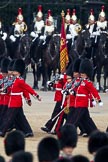 Trooping the Colour 2011: The Escort to the Colour. Carrying the flag in his white colour belt the ensign, Lieutenant Tom Ogilvy, and to his left, The Sergeant of the Ecort to the Colour, Colour Sergeant Chris Millin..
Horse Guards Parade, Westminster,
London SW1,
Greater London,
United Kingdom,
on 11 June 2011 at 11:43, image #269