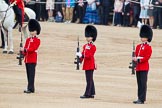 Trooping the Colour 2012: The Colour Party, the Colour Sergeant and the two Sentries, now without the Colour, presenting arms..
Horse Guards Parade, Westminster,
London SW1,

United Kingdom,
on 16 June 2012 at 11:22, image #315