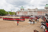 Trooping the Colour 2013: A wide angle overview of Horse Guards Parade during the March Past, with the Royal Colonels on both sides of the dais where HRH The Duke of Kent and HM The Queen are watching the March Past. Image #555, 15 June 2013 11:38 Horse Guards Parade, London, UK