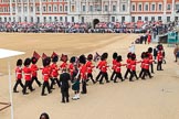 The 'Keepers of the Ground', guardsmen bearing marker flags for their respective regiments, marching towards Horse Guards Arch before The Colonel's Review 2018 (final rehearsal for Trooping the Colour, The Queen's Birthday Parade)  at Horse Guards Parade, Westminster, London, 2 June 2018, 09:53.